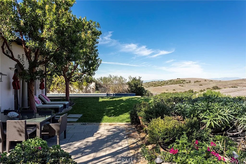 59 Vernal Spring Irvine, CA 92603 - Photo 25 of 33 an aerial view of a house with a garden
