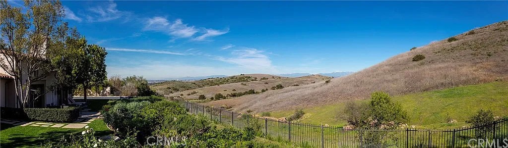 59 Vernal Spring Irvine, CA 92603 - Photo 26 of 33 a view of a yard with wooden fence