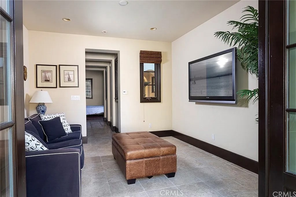 59 Vernal Spring Irvine, CA 92603 - Photo 29 of 33 a living room with furniture and a flat screen tv