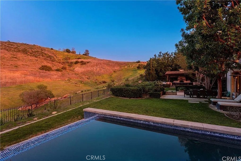59 Vernal Spring Irvine, CA 92603 - Photo 3 of 33 a view of a lake with a mountain in the background