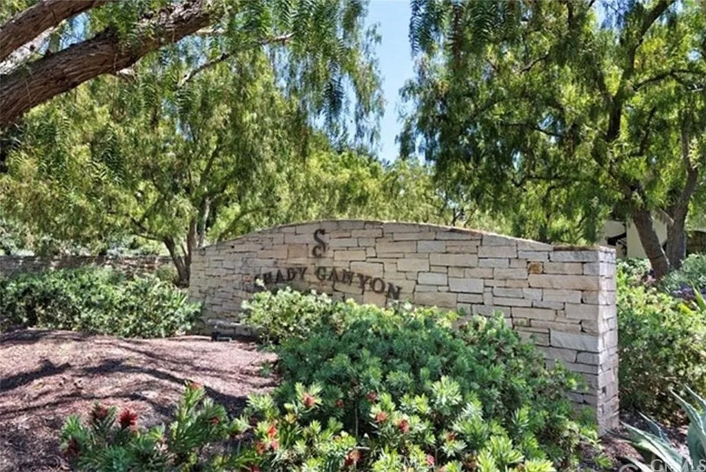 59 Vernal Spring Irvine, CA 92603 - Photo 32 of 33 a backyard of a house with lots of green space
