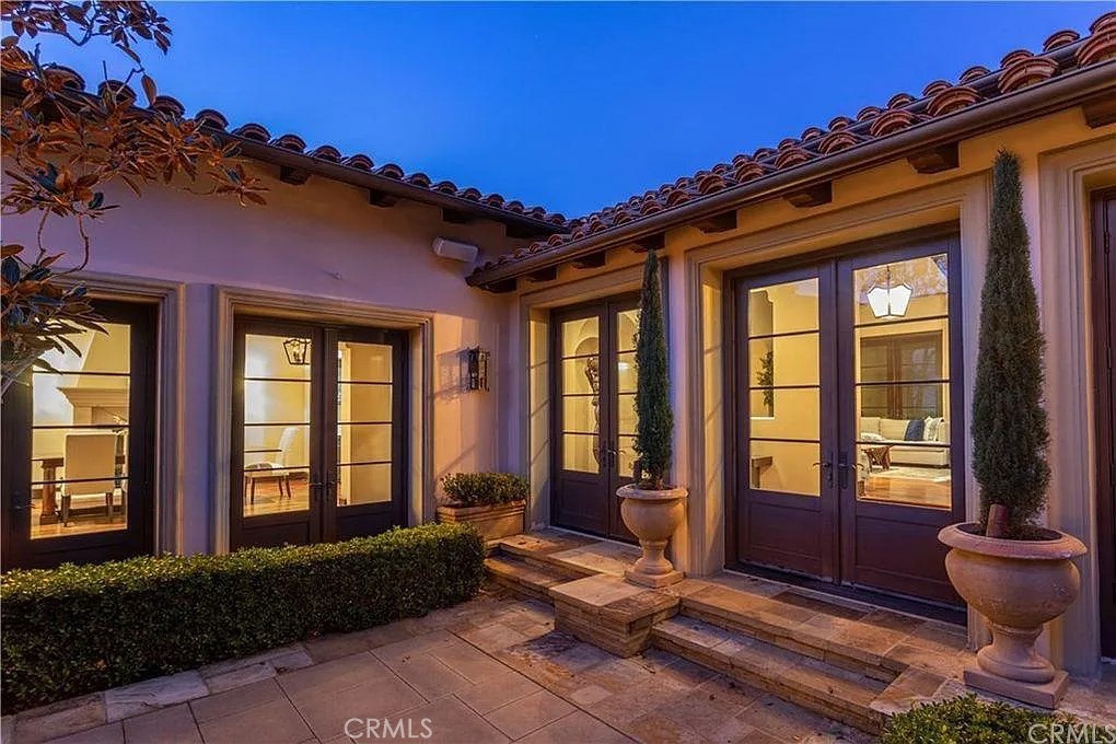 59 Vernal Spring Irvine, CA 92603 - Photo 7 of 33 a front view of a house with outdoor seating