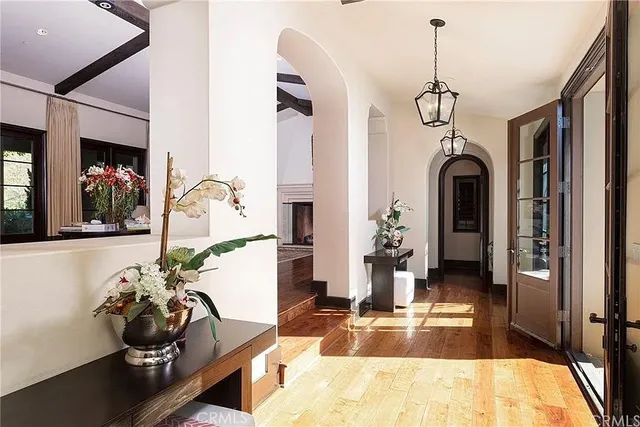 a view of a livingroom with furniture and lots of windows
