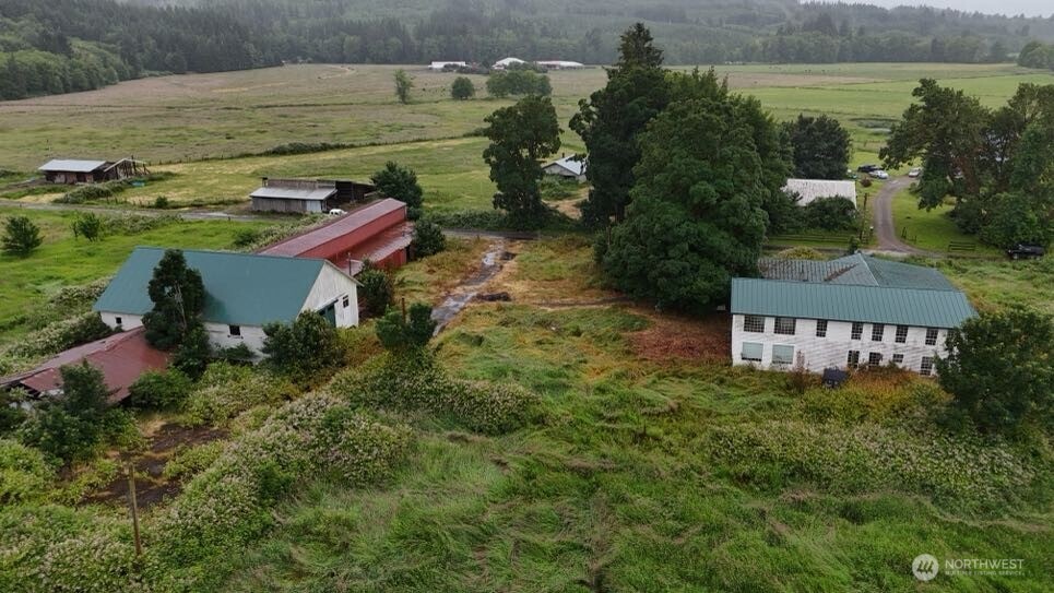 an aerial view of a house with a yard