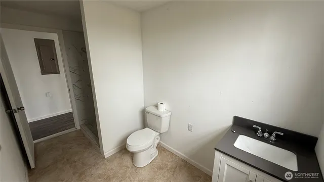 a bathroom with a toilet and a sink