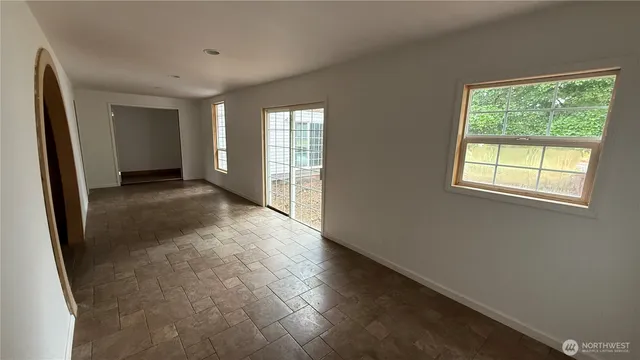 an empty room with windows