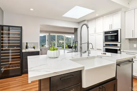 a view of a livingroom with furniture and a window