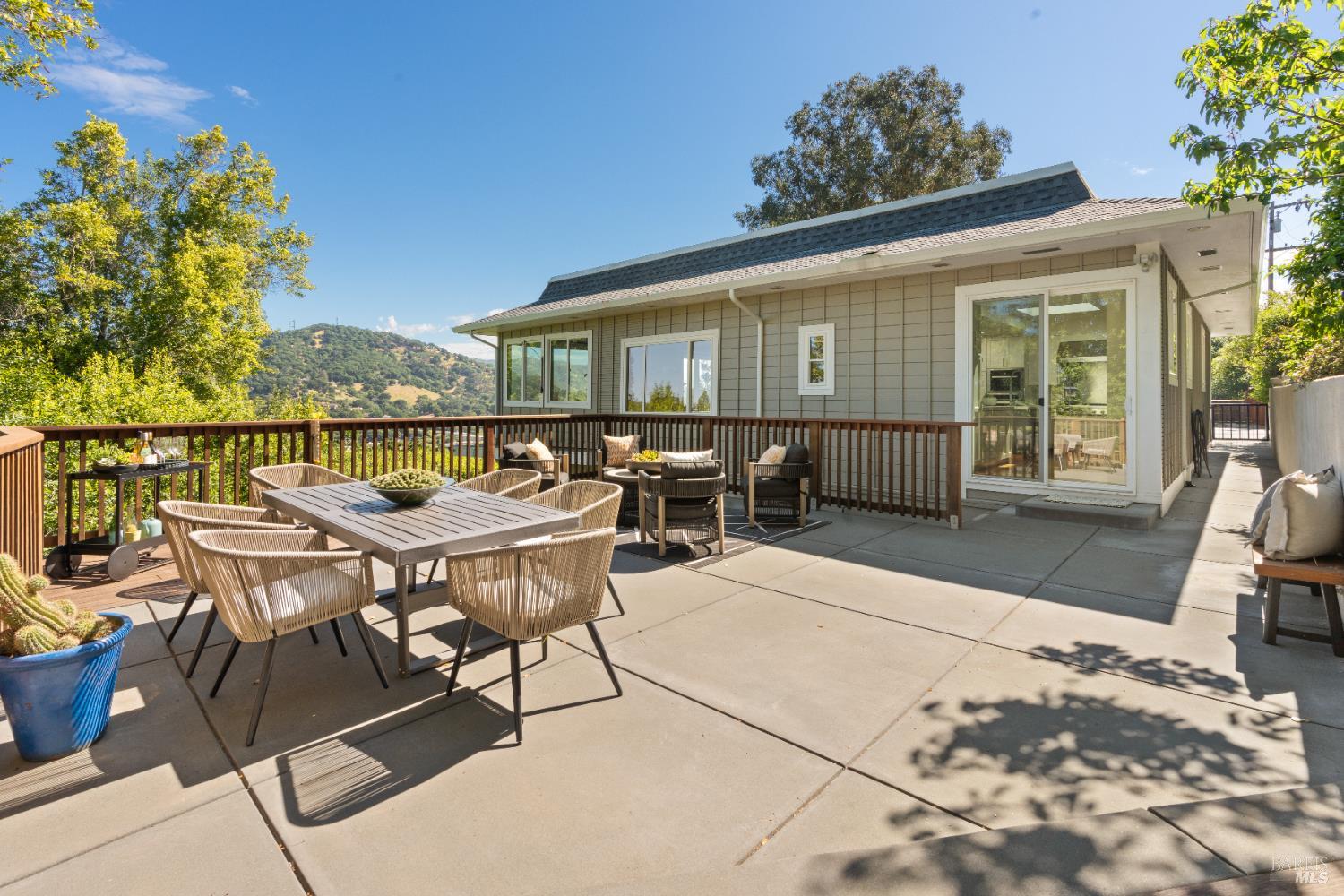 183 Reservoir Road San Rafael, CA 94901 - Photo 24 of 62 a roof deck with table and chairs couches with wooden floor