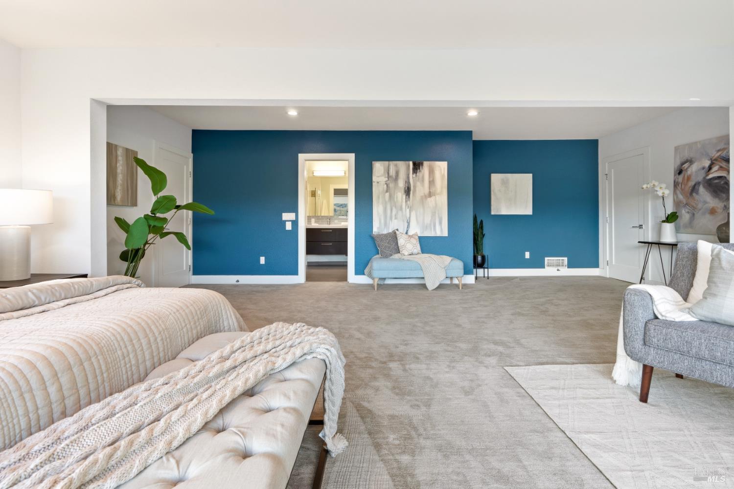 183 Reservoir Road San Rafael, CA 94901 - Photo 29 of 62 a bedroom with a large bed and a couch