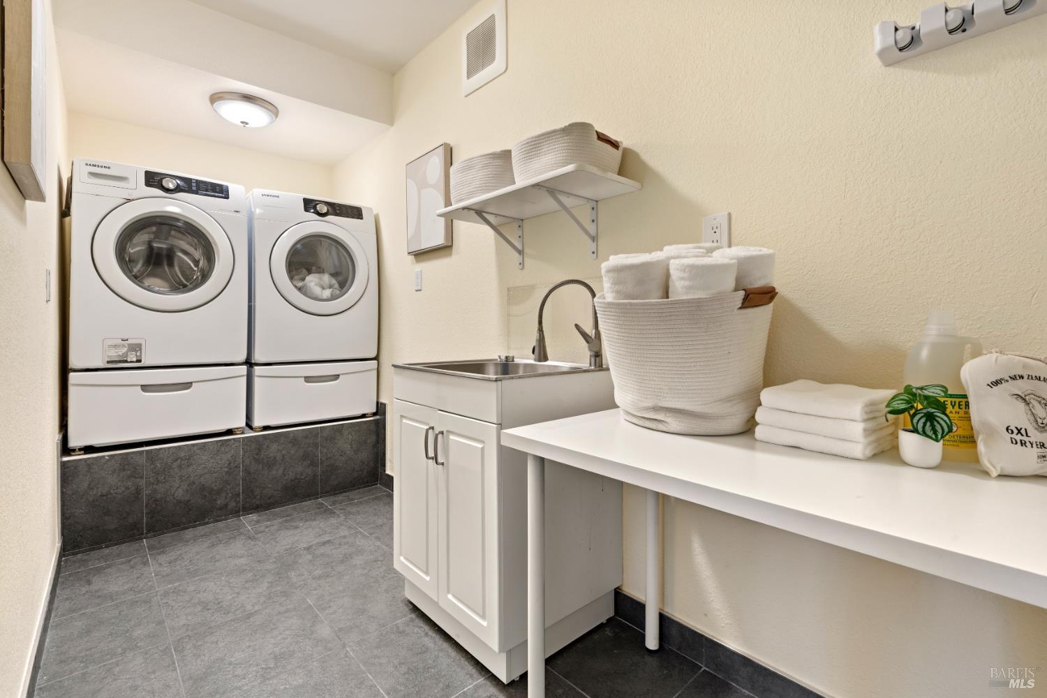 183 Reservoir Road San Rafael, CA 94901 - Photo 38 of 63 This is the laundry room that everyone wishes for with sink and room for a spacious folding table.