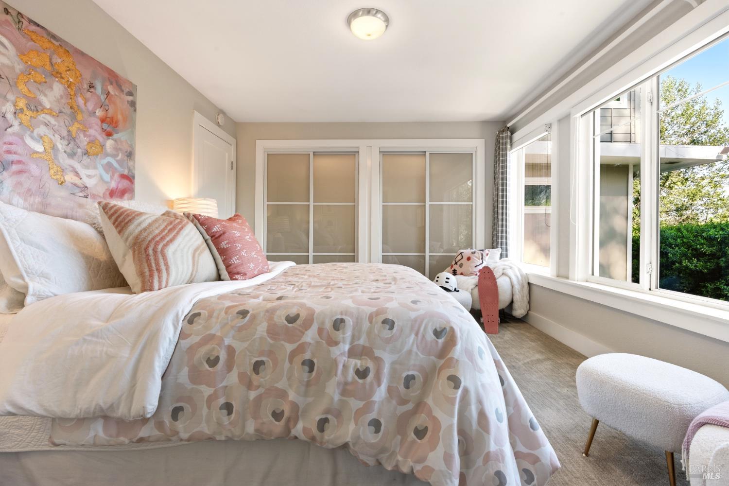 183 Reservoir Road San Rafael, CA 94901 - Photo 41 of 62 a bedroom with a bed and glass window