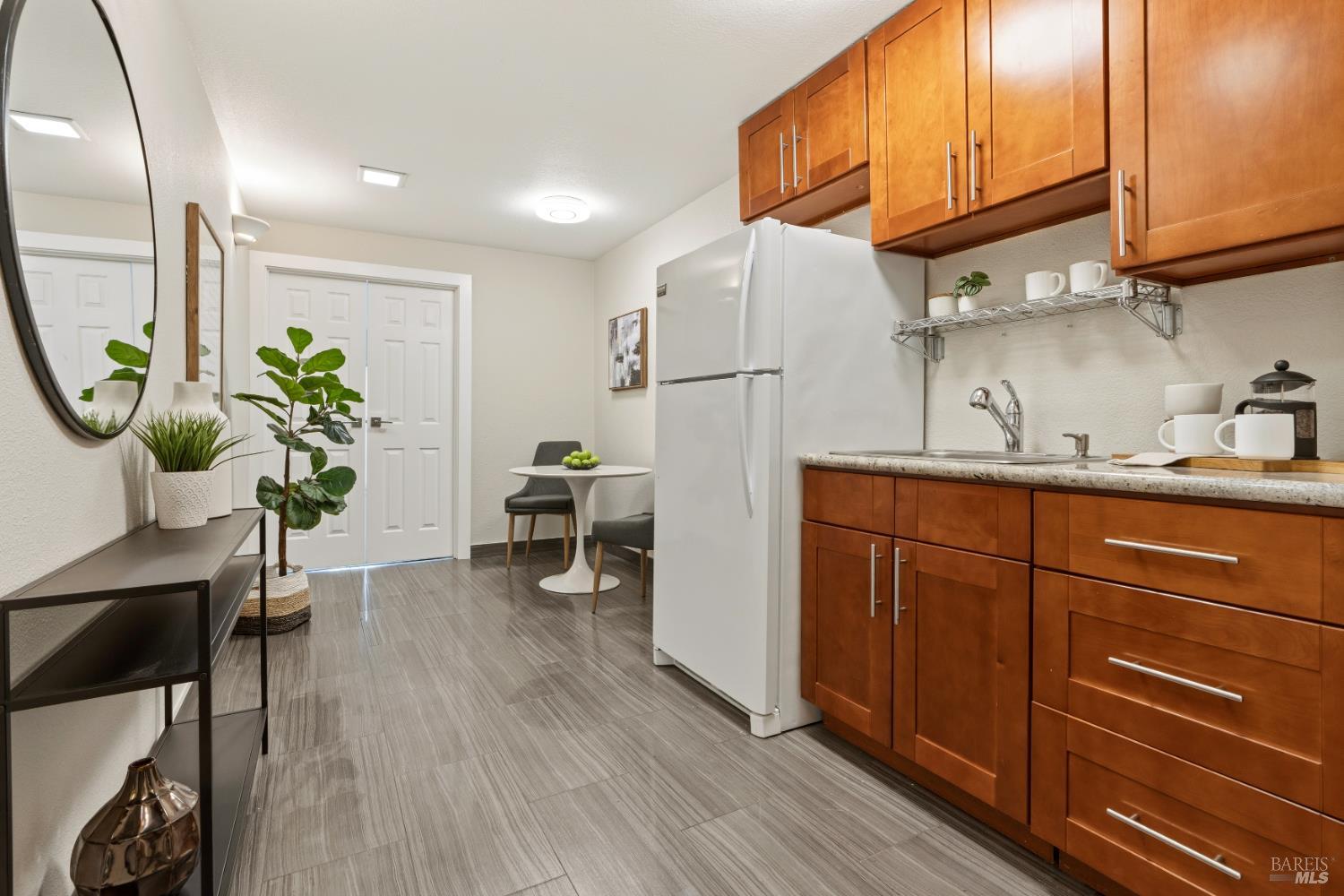 183 Reservoir Road San Rafael, CA 94901 - Photo 46 of 62 a kitchen with sink cabinets and wooden floor