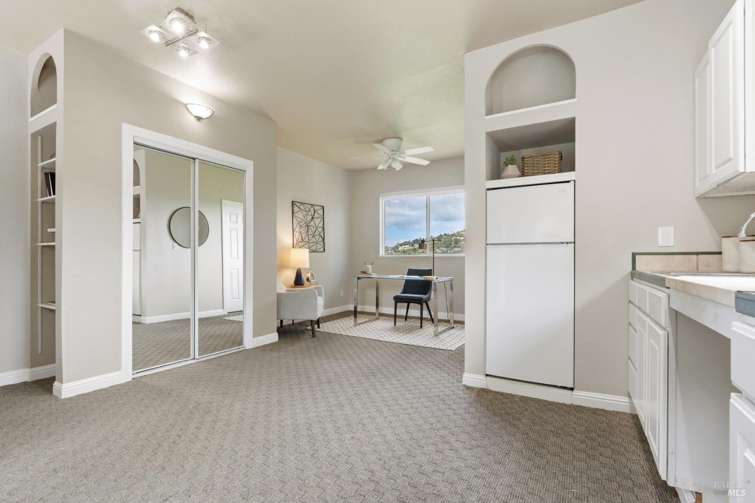 183 Reservoir Road San Rafael, CA 94901 - Photo 52 of 62 a view of a livingroom with furniture and a refrigerator