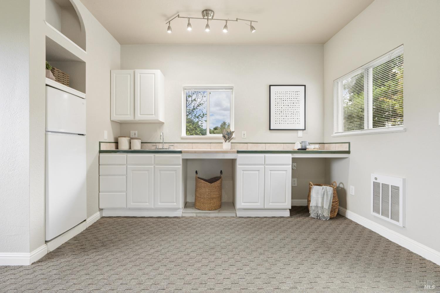 183 Reservoir Road San Rafael, CA 94901 - Photo 53 of 62 a kitchen with white cabinets stainless steel appliances and sink