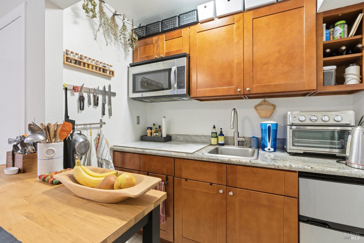 183 Reservoir Road San Rafael, CA 94901 - Photo 57 of 62 a kitchen with a sink stove and microwave