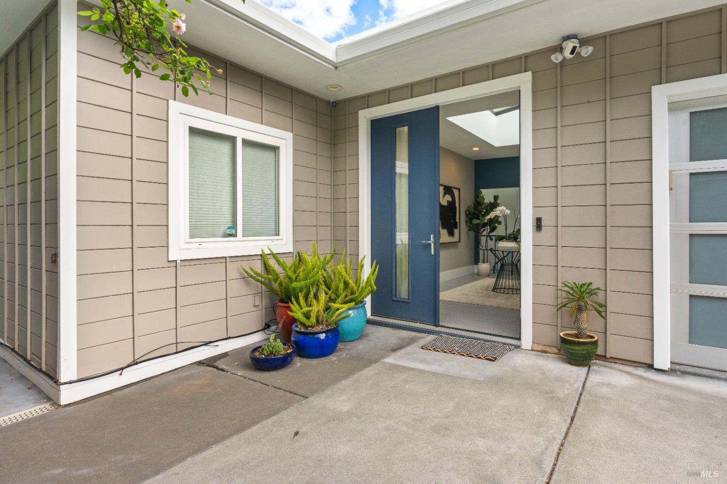 183 Reservoir Road San Rafael, CA 94901 - Photo 7 of 62 a view of a porch with a bench and potted plants