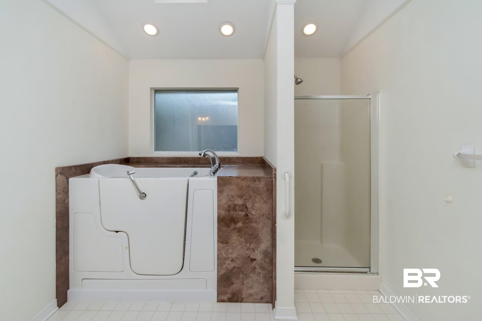 10006 Wedgefield Court Mobile, AL 36608 - Photo 17 of 34 Bathroom with a shower stall, washer / dryer, and recessed lighting