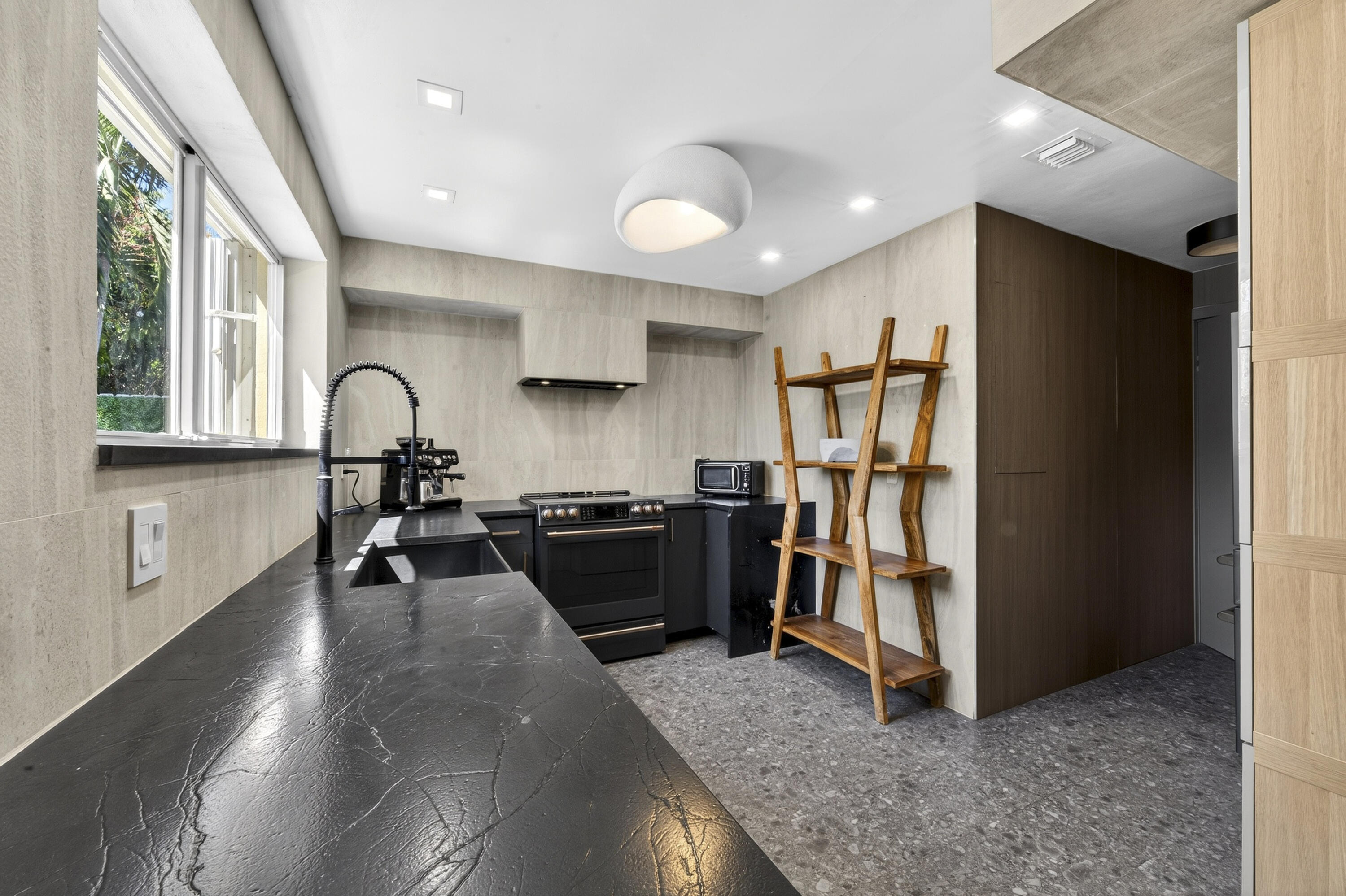 2630 Northeast 25th Street Lighthouse Point, FL 33064 - Photo 11 of 37 a view of kitchen with refrigerator and window