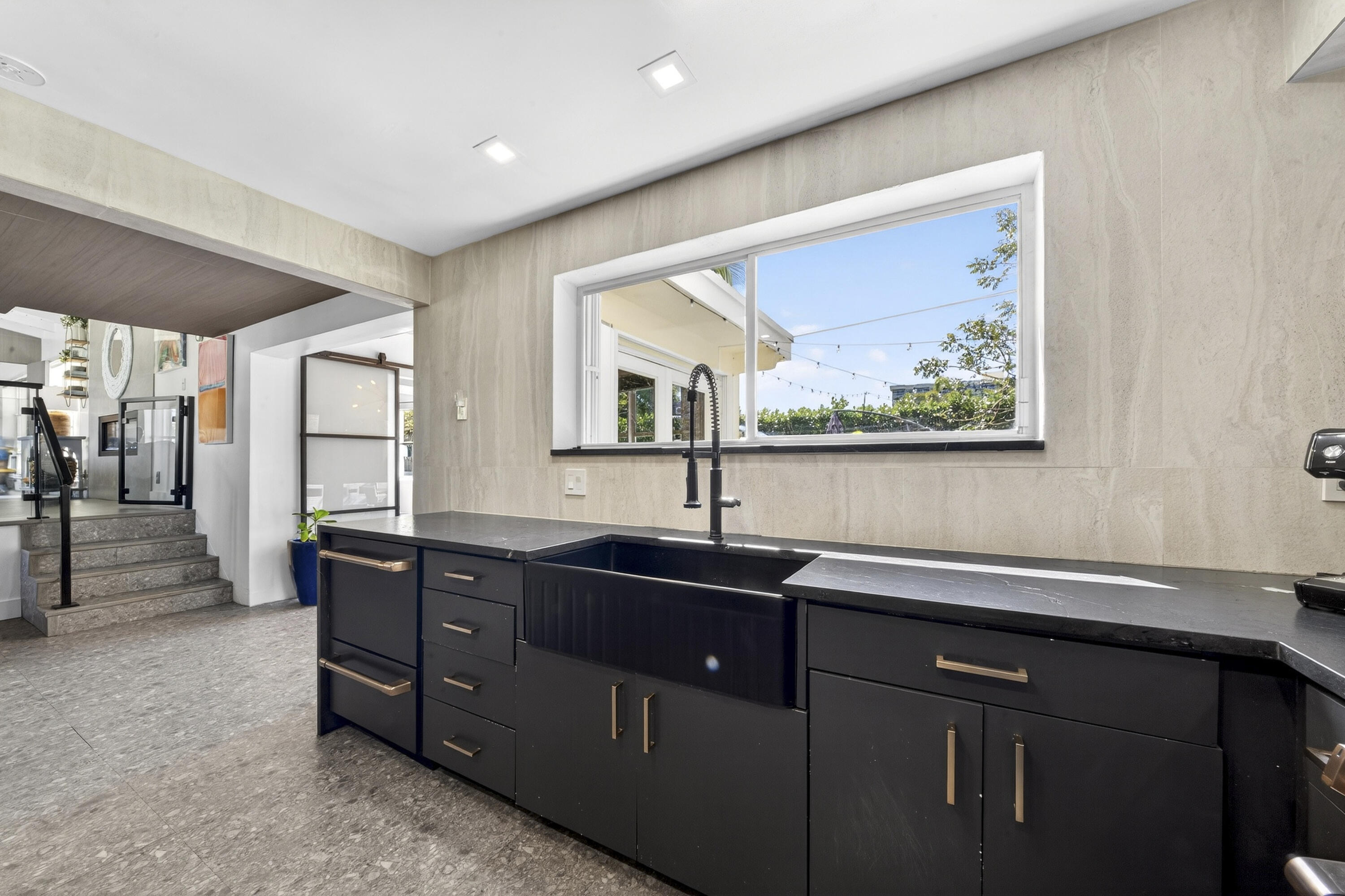 2630 Northeast 25th Street Lighthouse Point, FL 33064 - Photo 13 of 37 a kitchen with a sink and large window