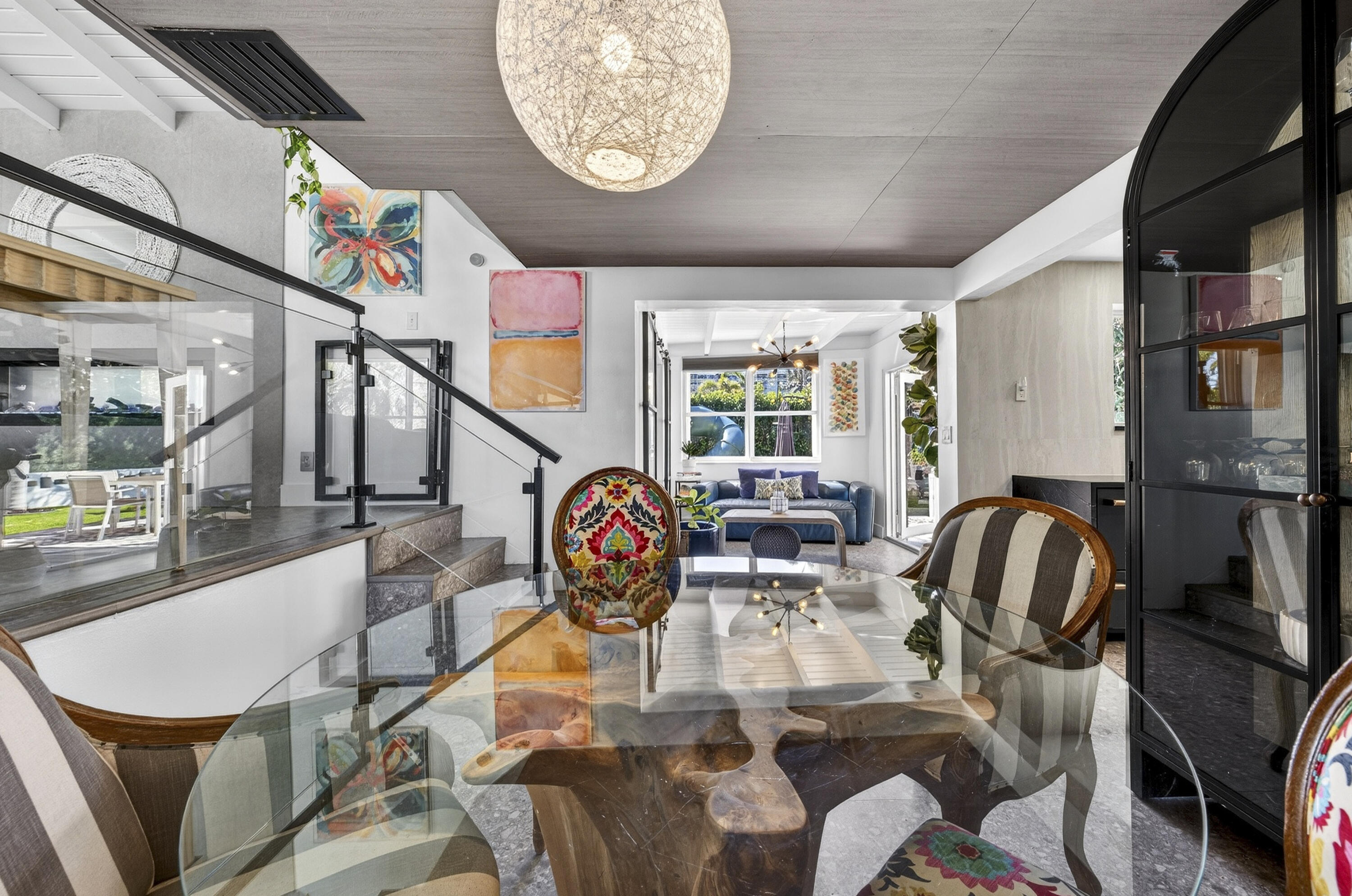 2630 Northeast 25th Street Lighthouse Point, FL 33064 - Photo 14 of 37 a dining room with furniture a rug and wooden floor