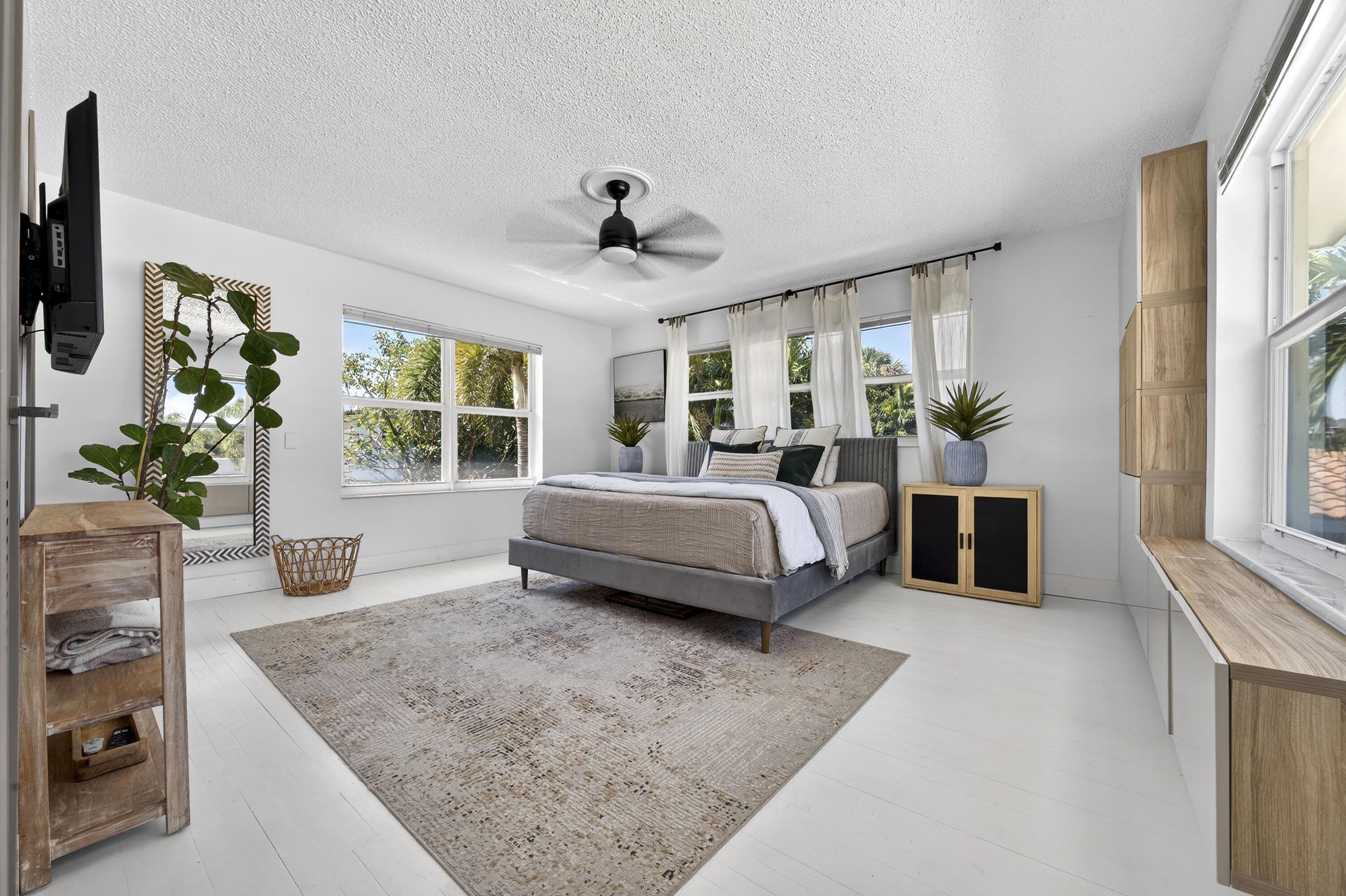 2630 Northeast 25th Street Lighthouse Point, FL 33064 - Photo 15 of 37 a bedroom with a large bed and a window