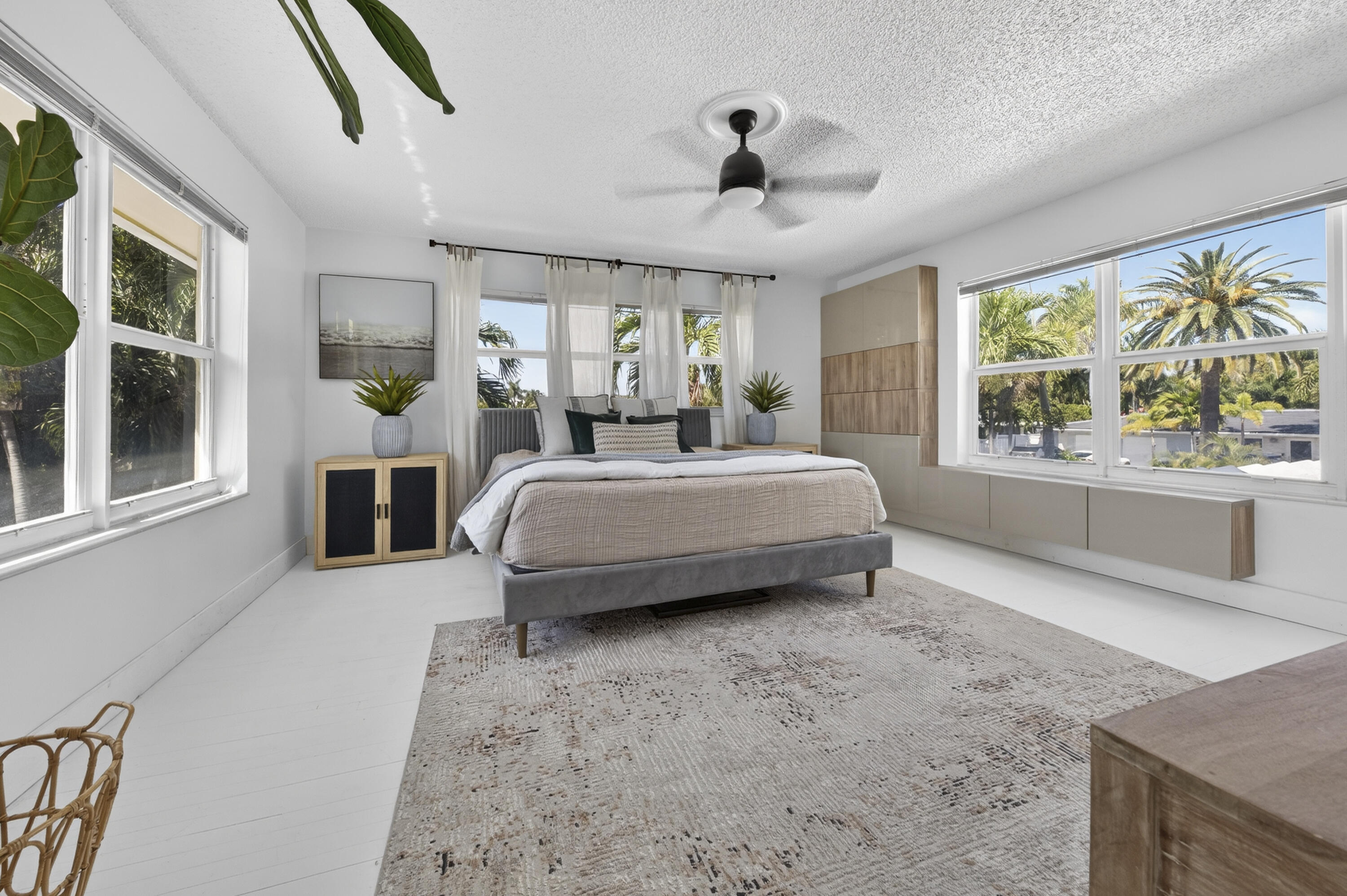 2630 Northeast 25th Street Lighthouse Point, FL 33064 - Photo 16 of 37 a bed room with a bed and a large window