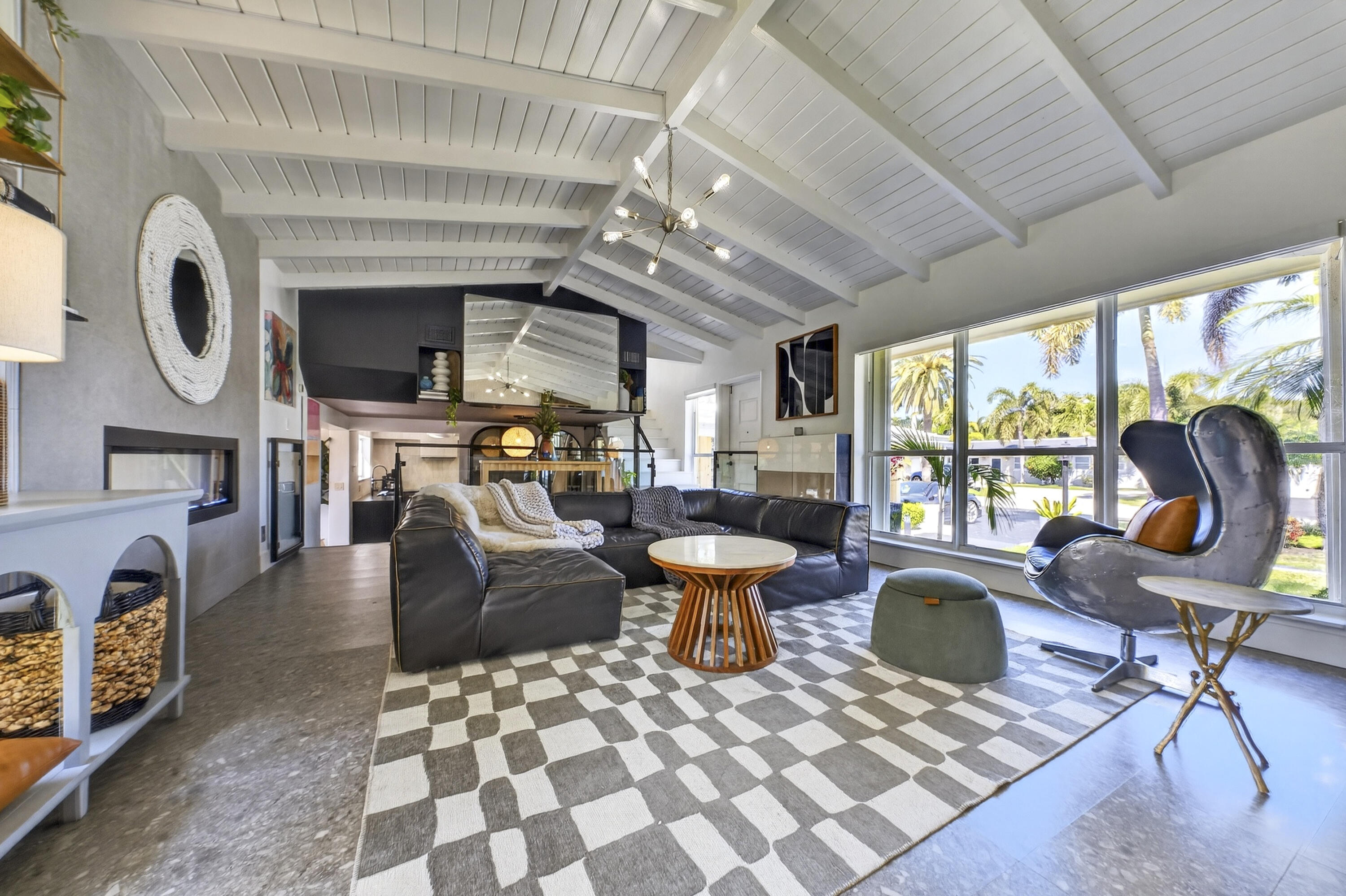 2630 Northeast 25th Street Lighthouse Point, FL 33064 - Photo 22 of 37 a living room with furniture a window and a fireplace