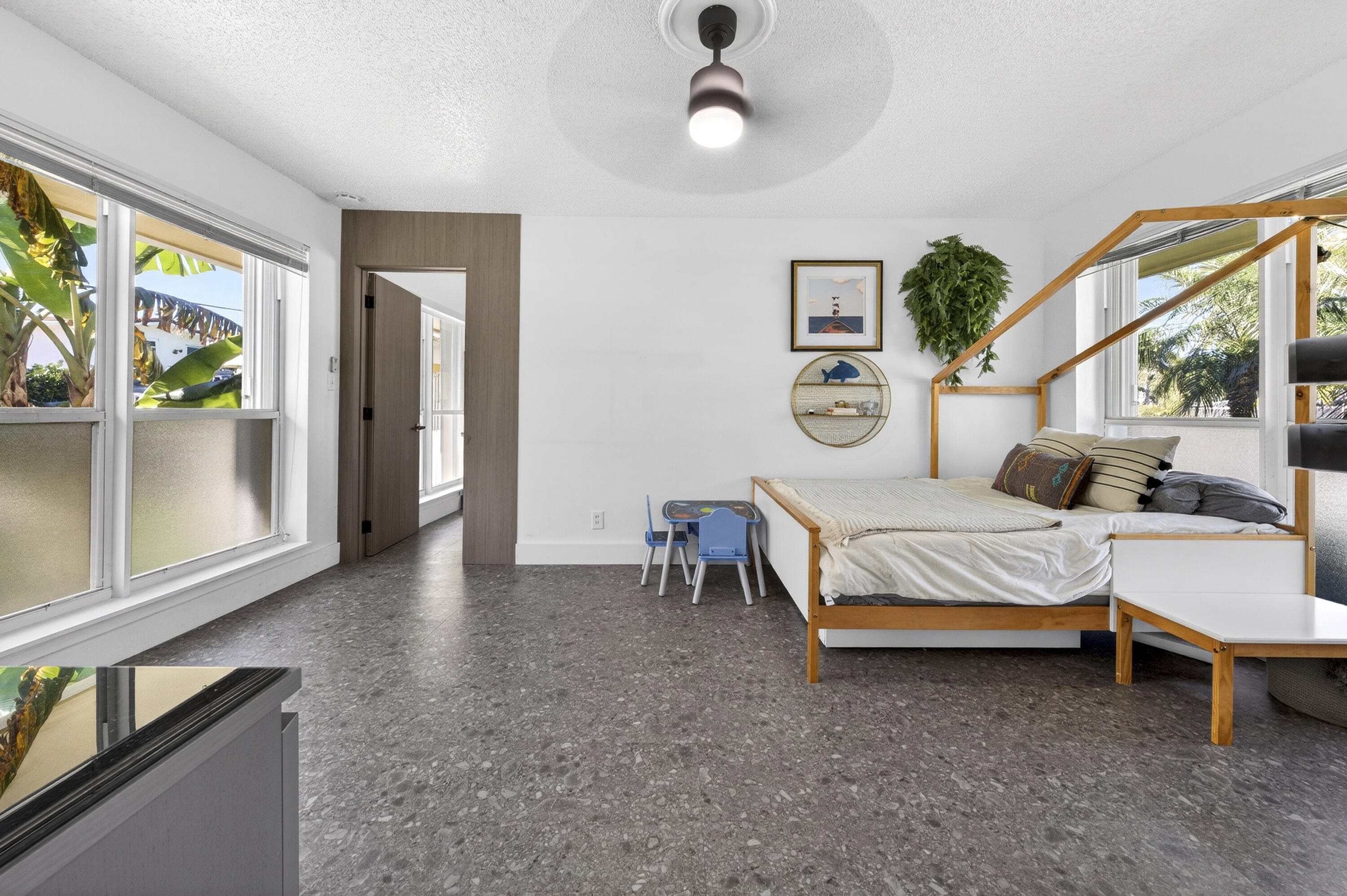 2630 Northeast 25th Street Lighthouse Point, FL 33064 - Photo 23 of 37 a bedroom with a bed and a large window with the outer view