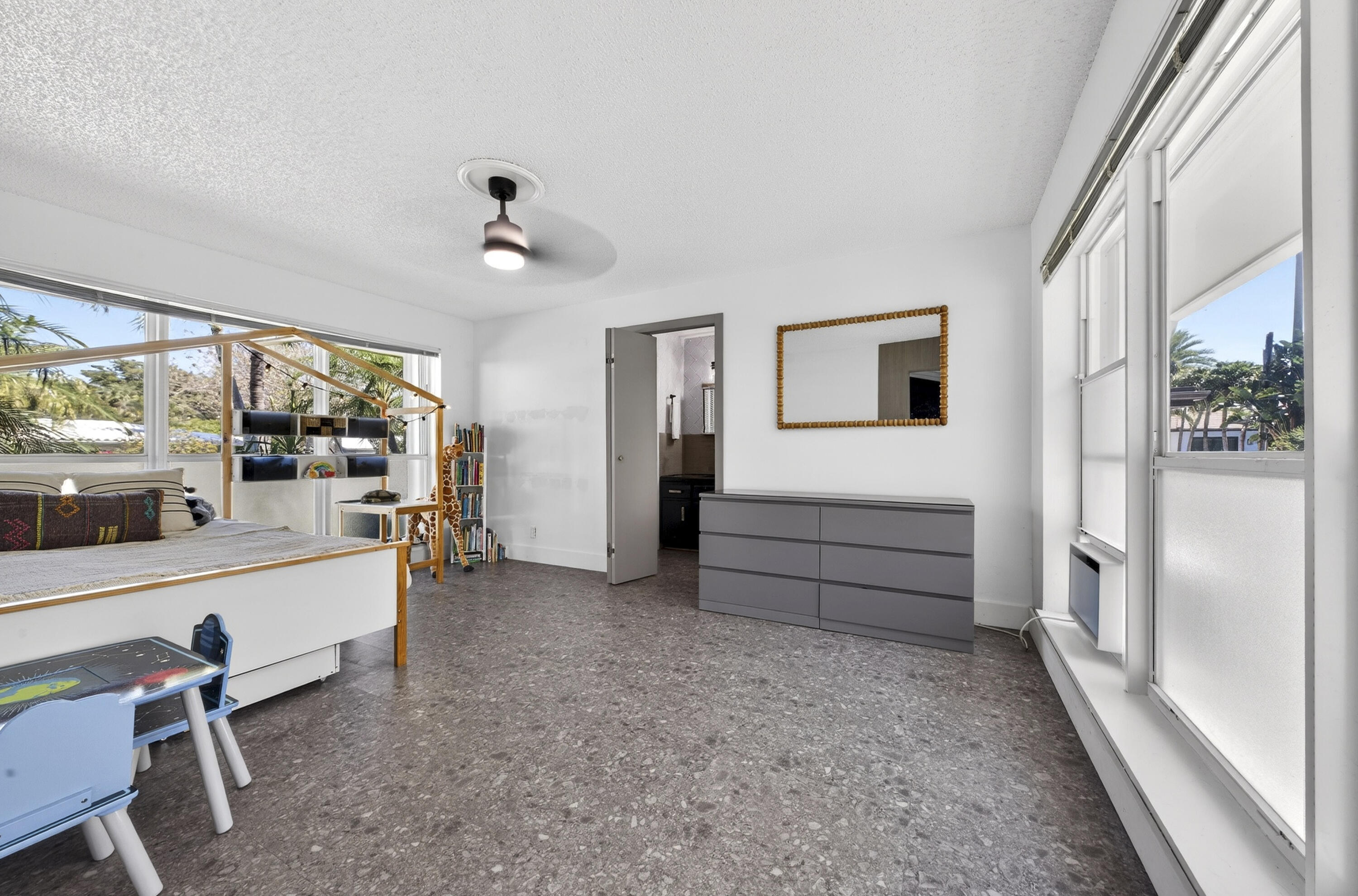 2630 Northeast 25th Street Lighthouse Point, FL 33064 - Photo 24 of 37 a view of an entryway with wooden floor and windows