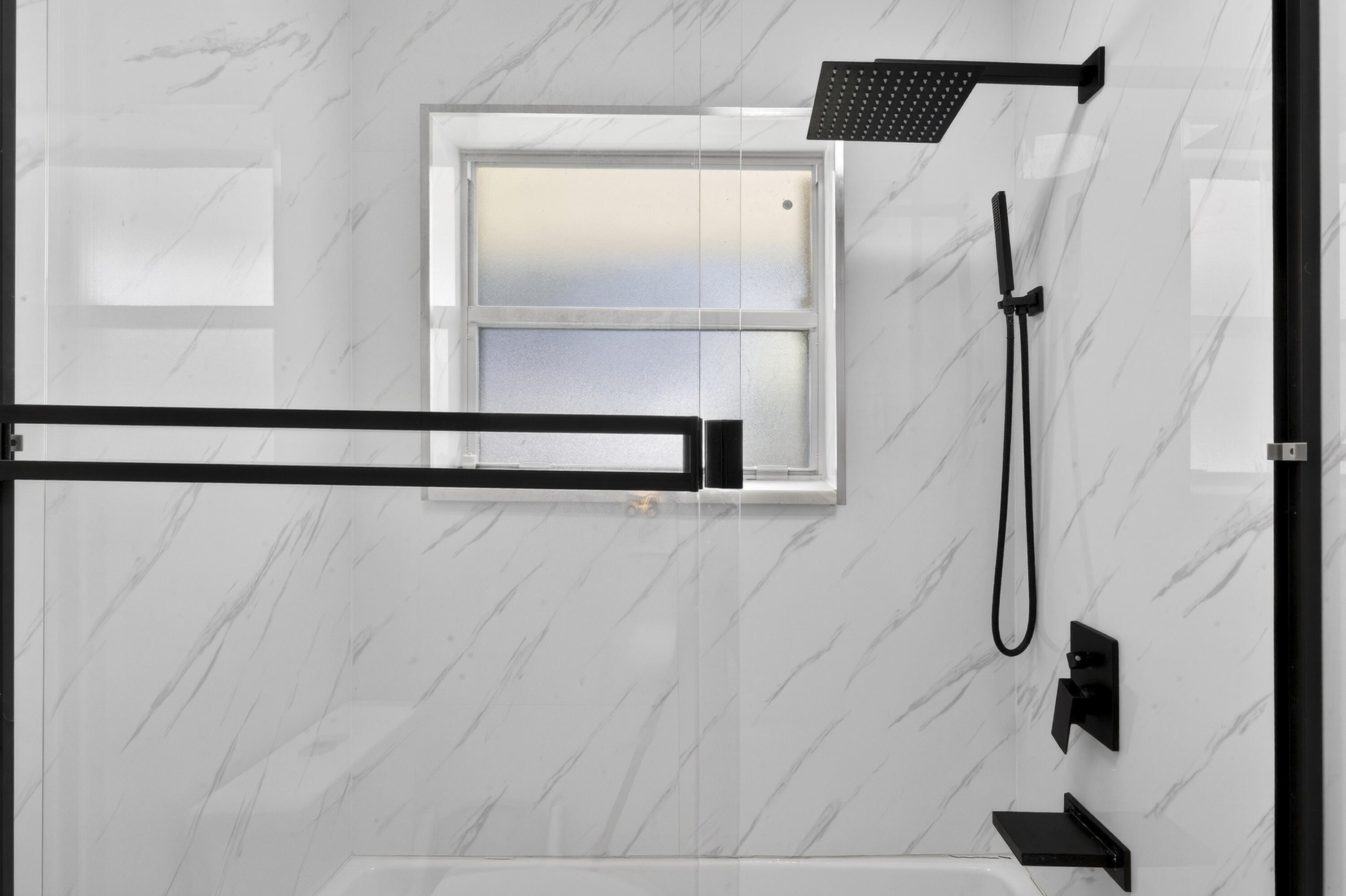 2630 Northeast 25th Street Lighthouse Point, FL 33064 - Photo 25 of 37 a bathroom with a shower