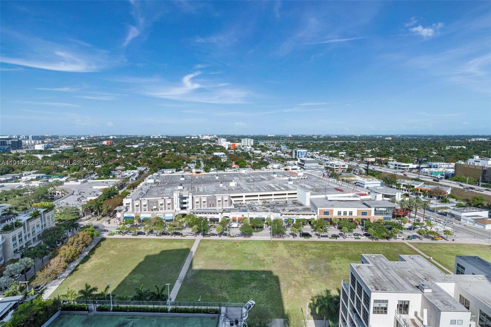 121 Northeast 34th Street, Unit 2109 Miami, FL 33137 - Photo 18 of 19 an aerial view of a city with lawn chairs