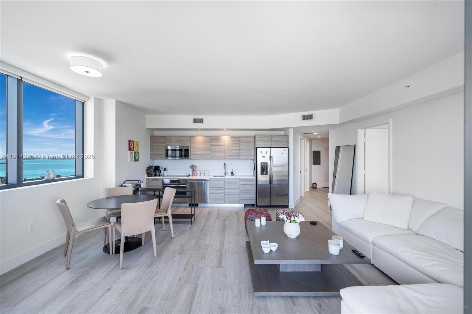 121 Northeast 34th Street, Unit 2109 Miami, FL 33137 - Photo 4 of 19 a living room with furniture and wooden floor