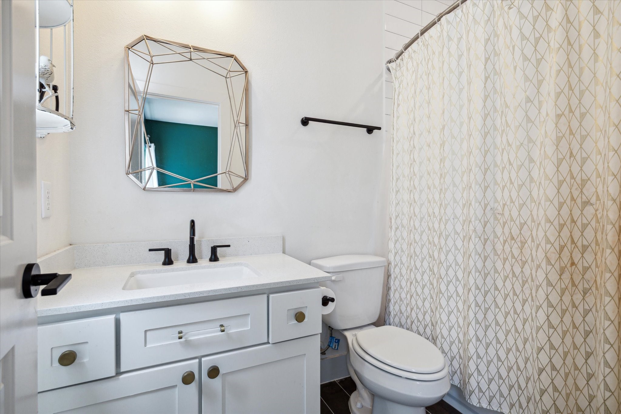 1747 Ojeman Spring Lane Houston, TX 77055 - Photo 17 of 22 a bathroom with a toilet a sink and mirror
