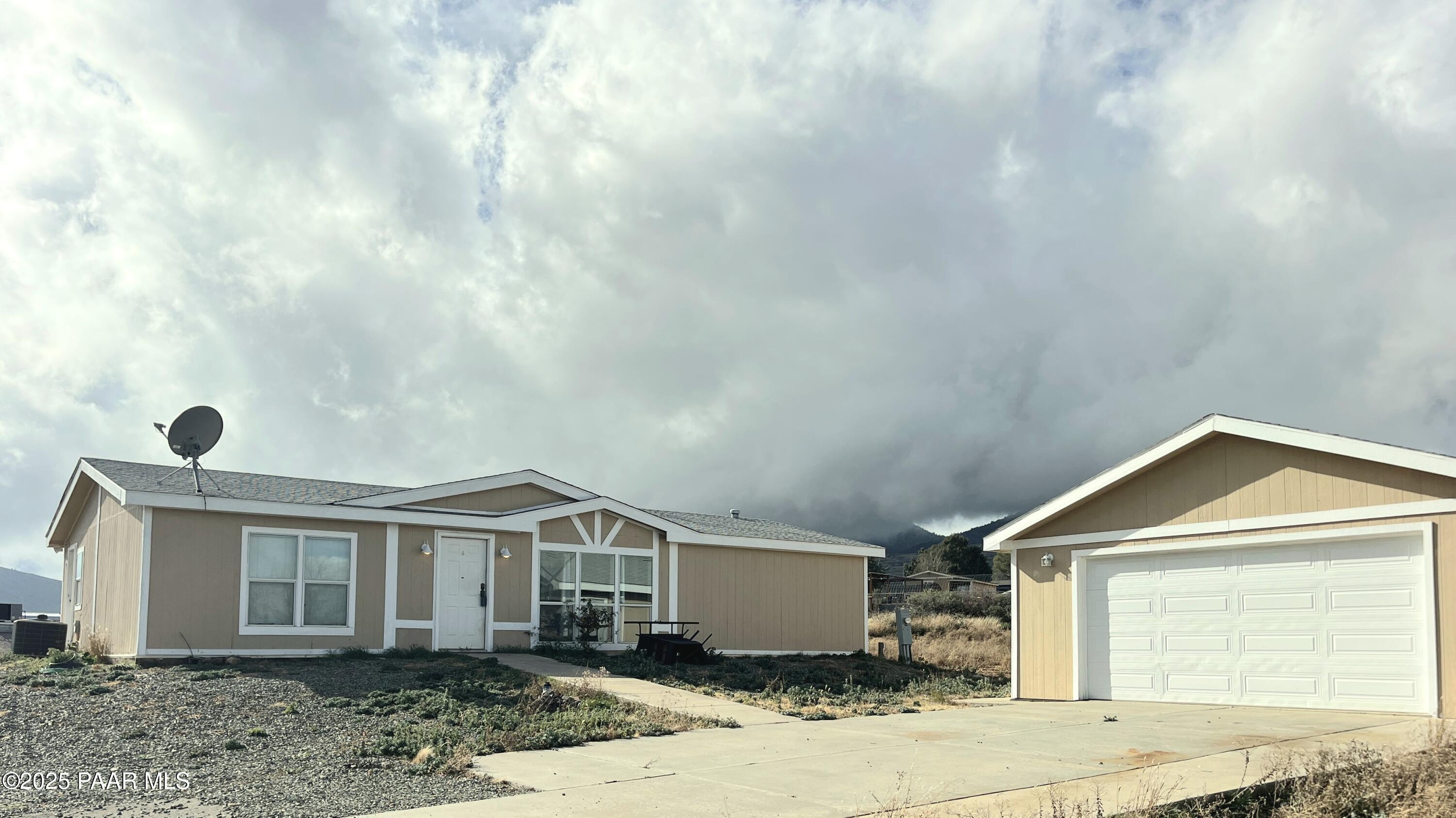 a front view of a house with yard