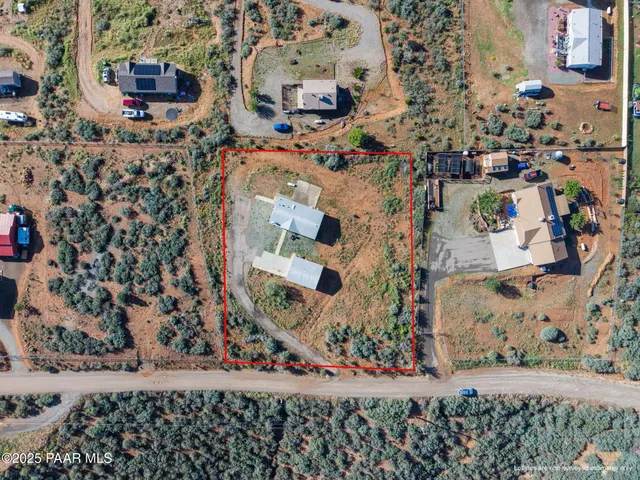 a aerial view of a house with a yard