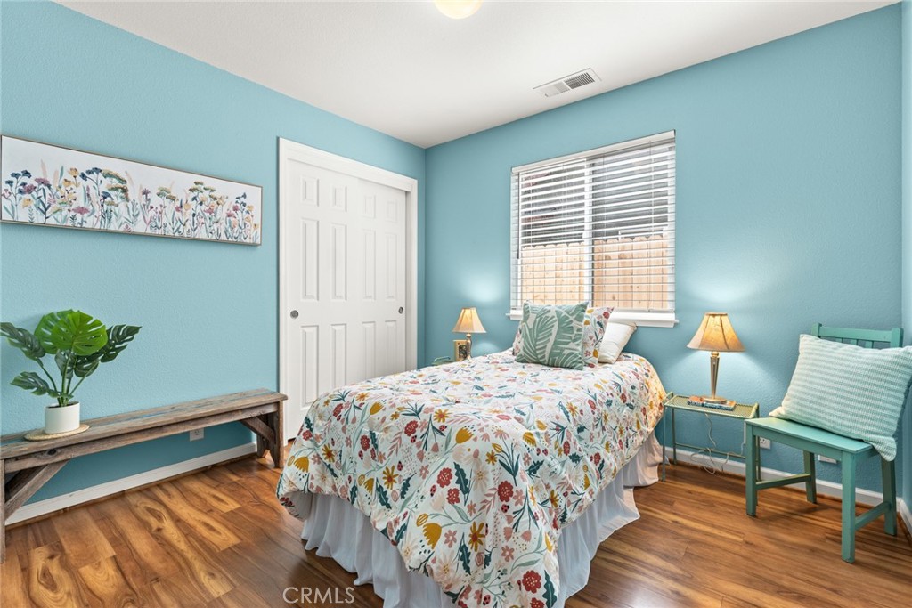 1517 Ridgebrook Way Chico, CA 95928 - Photo 17 of 28 a bedroom with a bed and a table in it