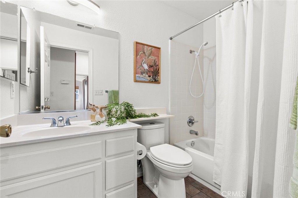 1517 Ridgebrook Way Chico, CA 95928 - Photo 18 of 28 a bathroom with a sink a toilet and shower curtain