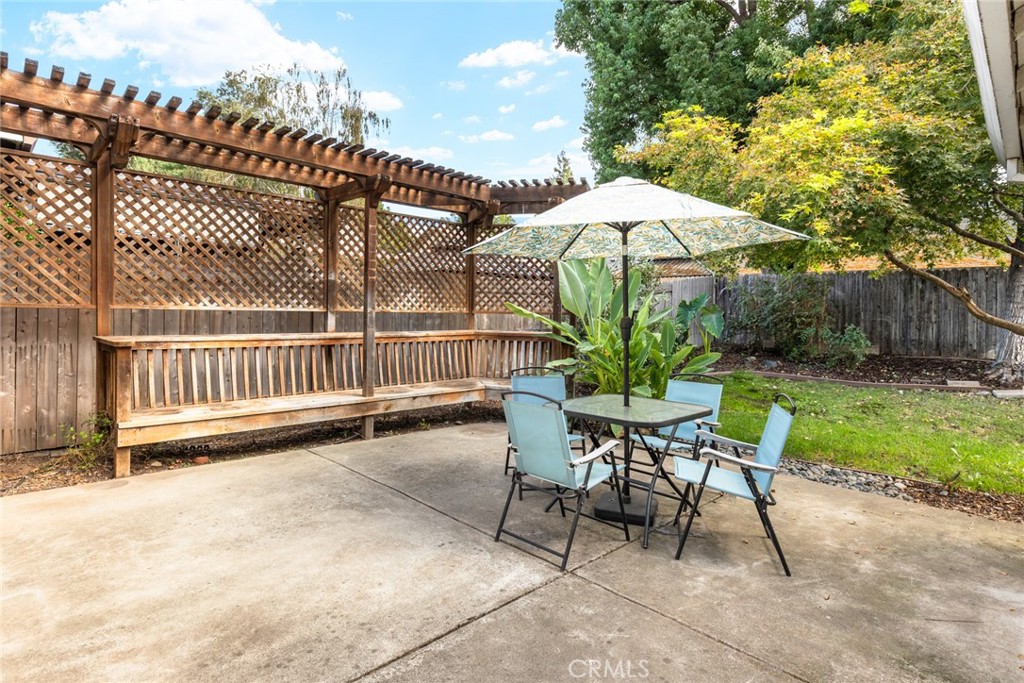 1517 Ridgebrook Way Chico, CA 95928 - Photo 20 of 28 a view of a chair and table in backyard