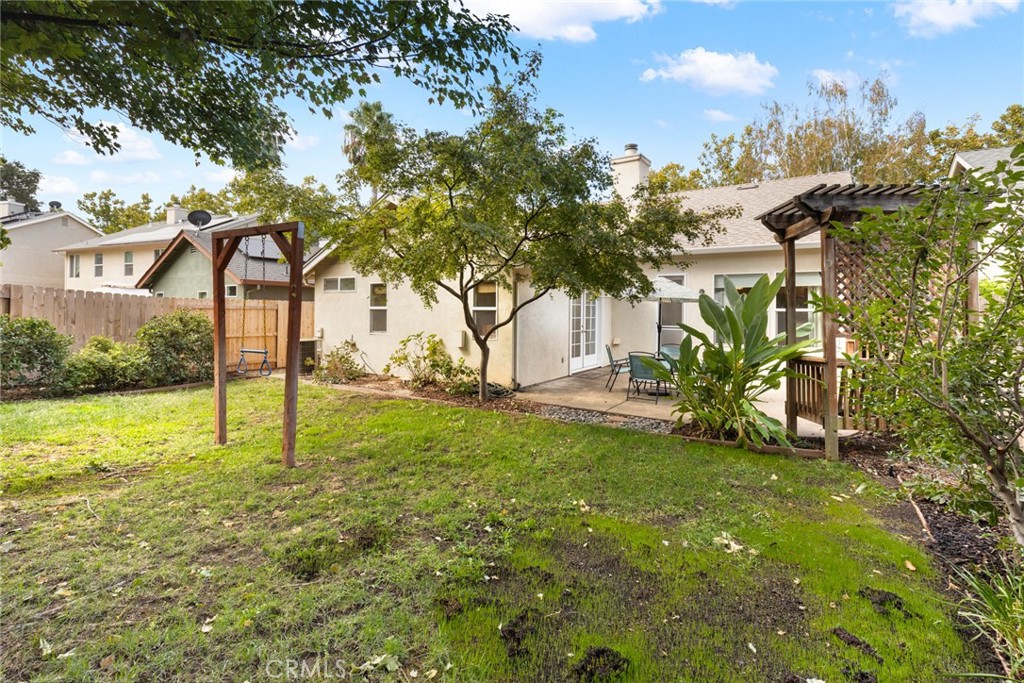1517 Ridgebrook Way Chico, CA 95928 - Photo 24 of 28 a view of a yard with a tree