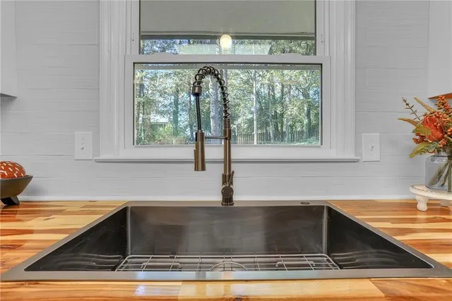 a kitchen with a stove microwave and sink