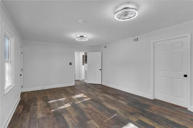 a bathroom with a granite countertop sink a shower and a mirror
