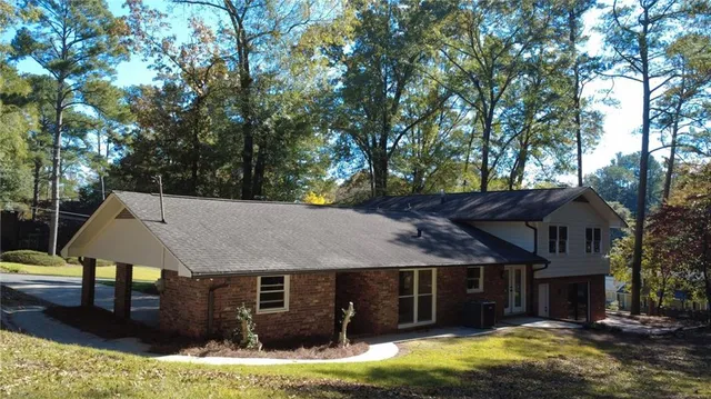 a front view of a house with a yard balcony