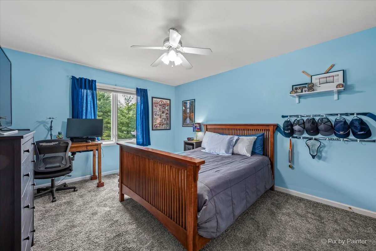 7104 Dove Way Cary, IL 60013 - Photo 36 of 82 a bed room with a bed and a chair