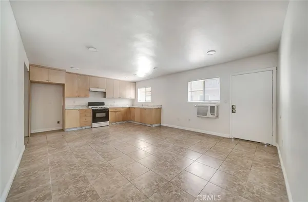 a view of a kitchen with a sink and a stove top oven