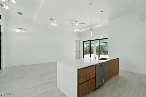 a room with a sink vanity and a mirror