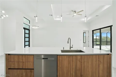 a kitchen with a sink and a window