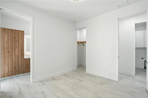 an empty room with wooden floor