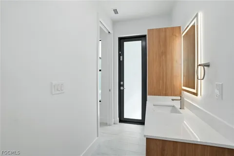 a view of a bathroom with sink and shower