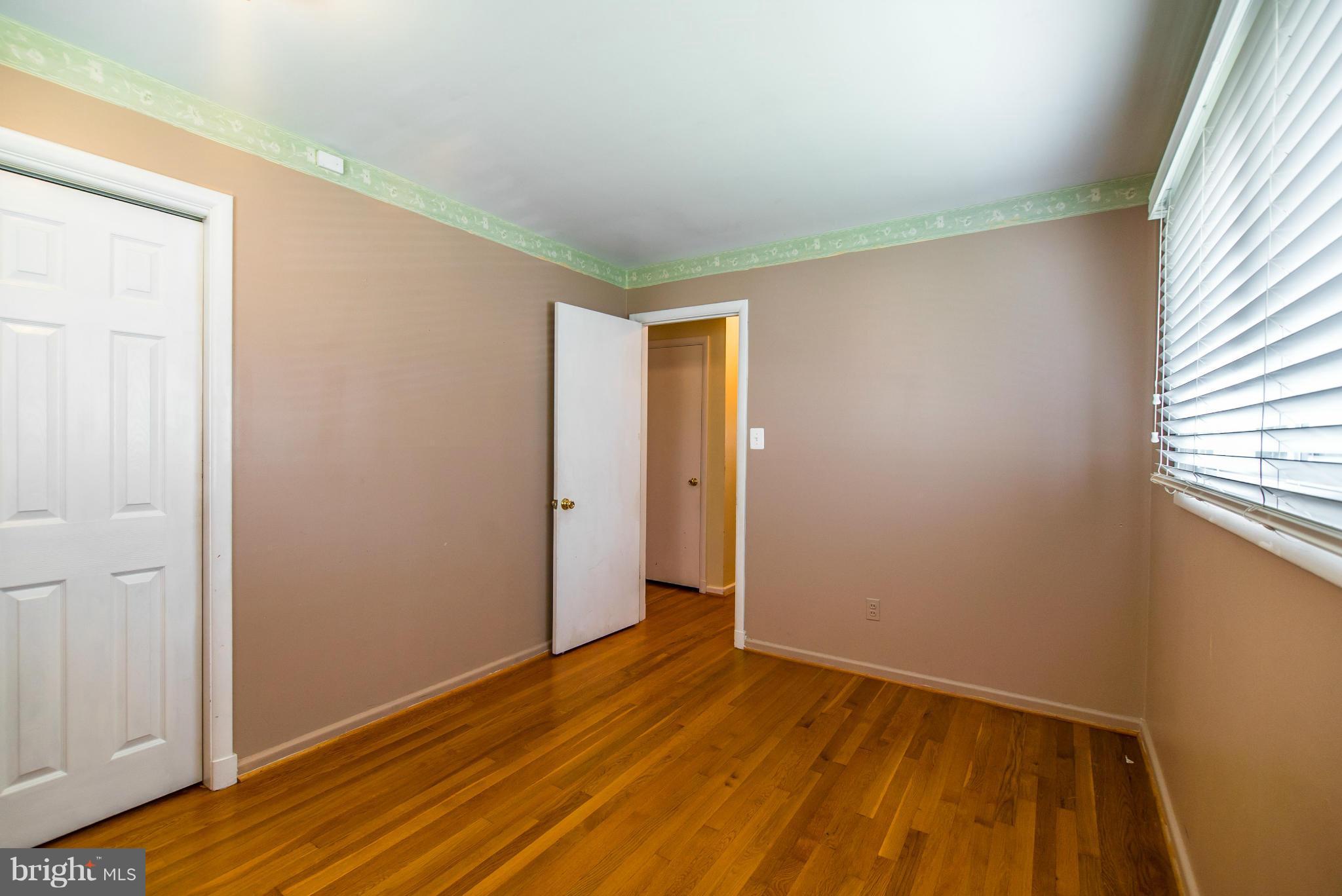 508 Orrin Street Southeast Vienna, VA 22180 - Photo 12 of 30 a view of an empty room with wooden floor and a window