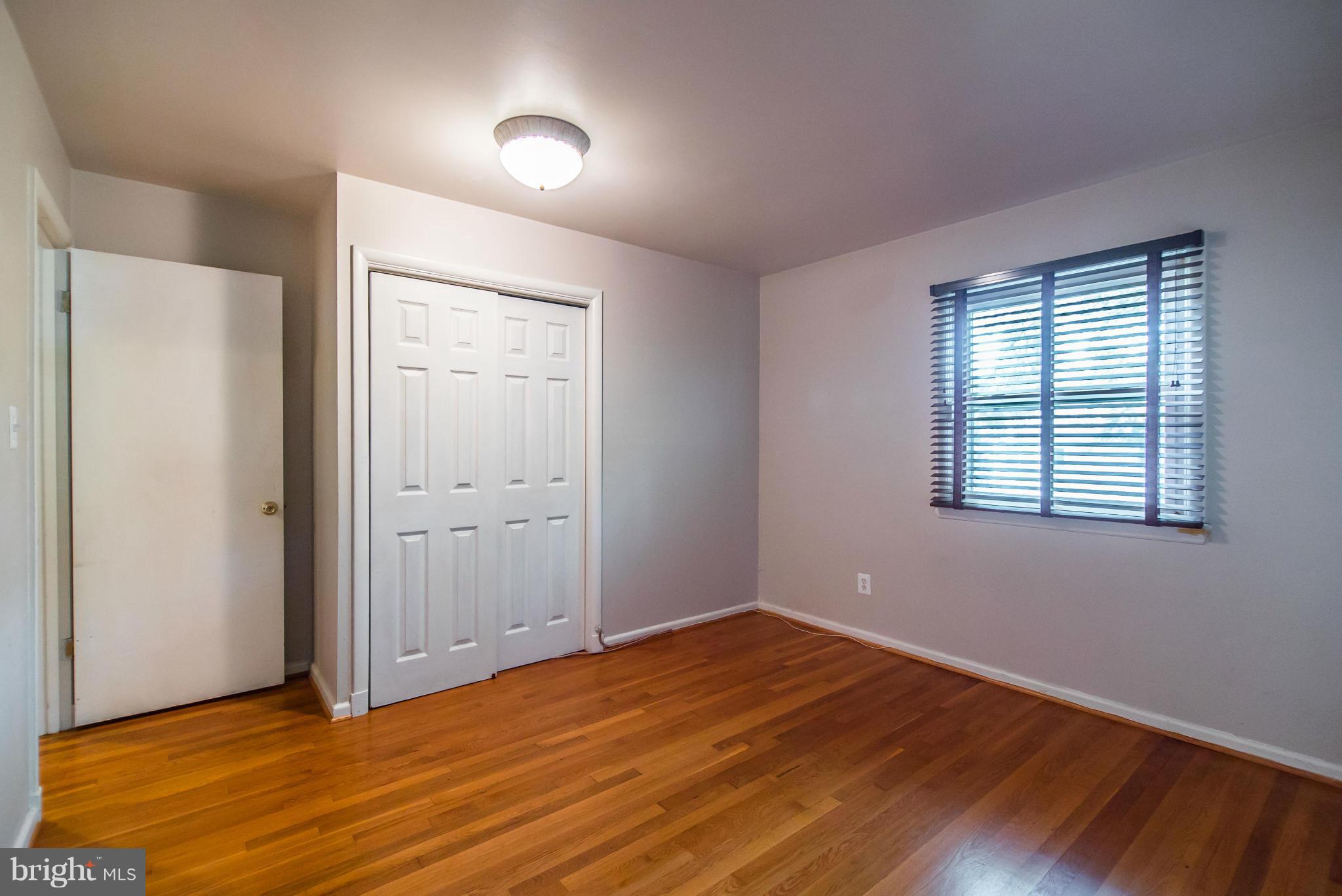 508 Orrin Street Southeast Vienna, VA 22180 - Photo 14 of 30 an empty room with wooden floor and windows